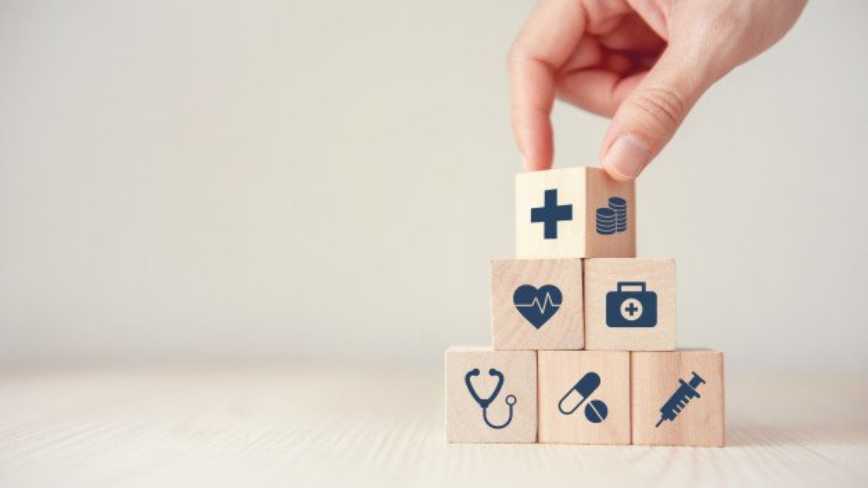 health-insurance-concept-reduce-medical-expenses-hand-flip-wood-cube-with-icon-healthcare-medical-coin-wood-background-copy-space_52701-34